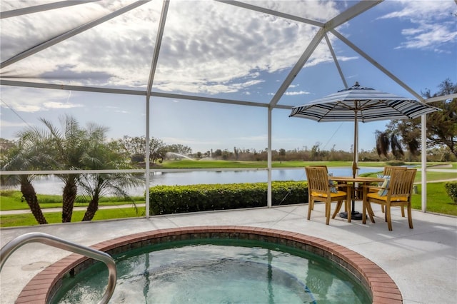 view of pool featuring a patio, a water view, a hot tub, and a lanai