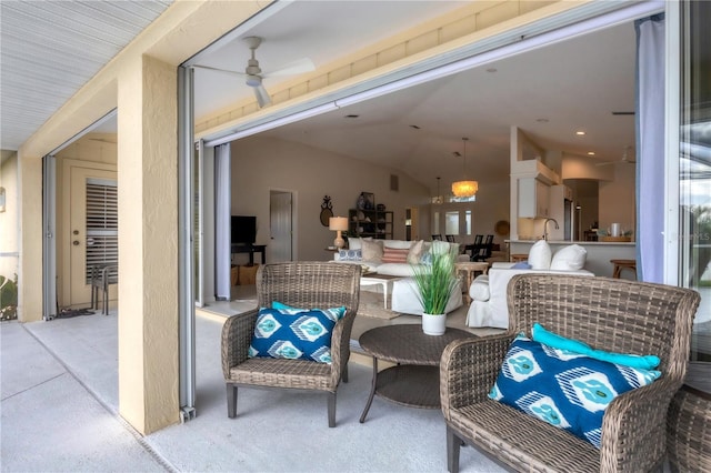 exterior space featuring ceiling fan and an outdoor hangout area