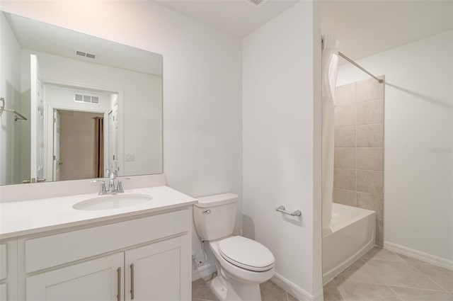 full bathroom featuring tile patterned flooring, vanity, toilet, and tiled shower / bath