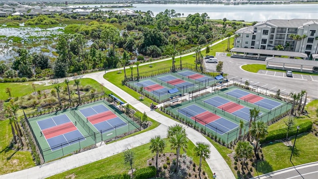 birds eye view of property with a water view