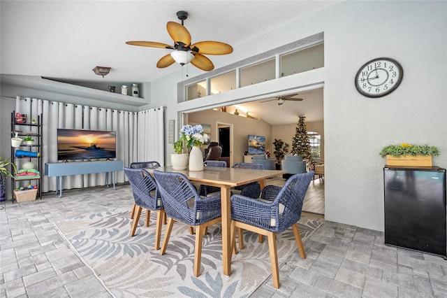 dining room featuring lofted ceiling