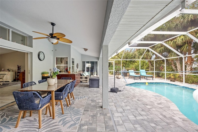 view of pool featuring a lanai, ceiling fan, and a patio