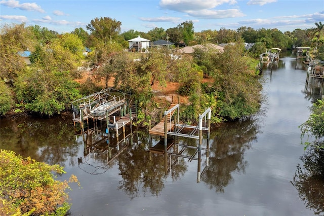 28522 Coco Palm Dr, Punta Gorda, FL 33982 - dock with boat lift, a water view, and view of scattered trees