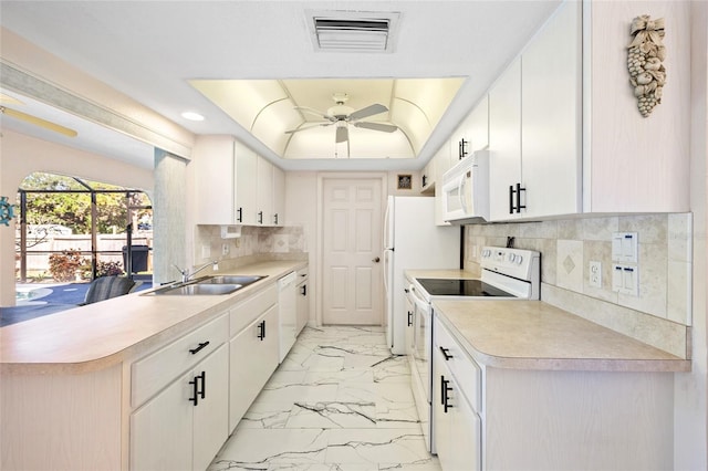 kitchen with white cabinetry, white appliances, and sink