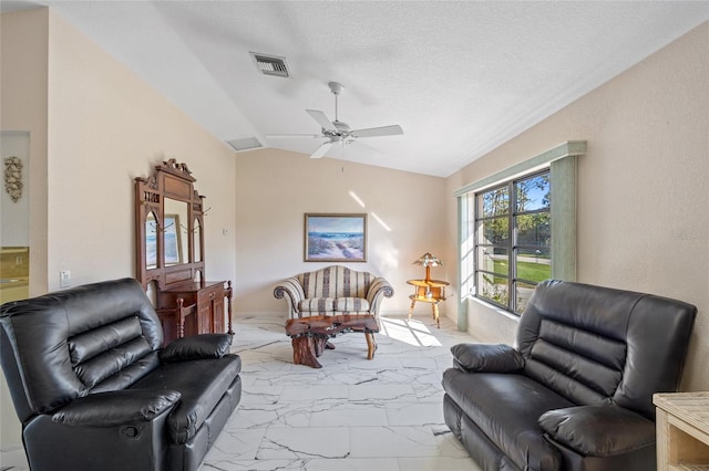 living room with ceiling fan and lofted ceiling