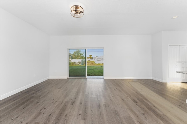 spare room featuring hardwood / wood-style flooring