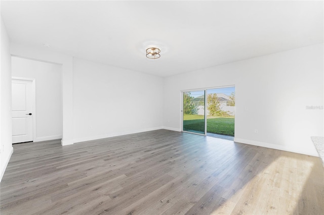 spare room featuring light hardwood / wood-style floors