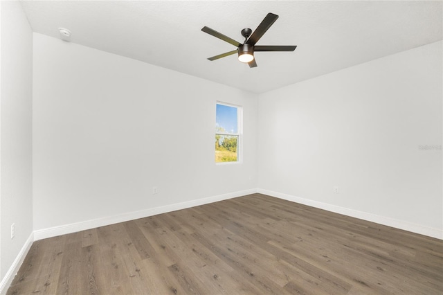 spare room featuring ceiling fan and wood-type flooring