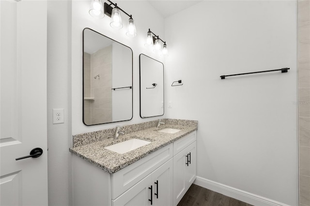 bathroom with hardwood / wood-style floors and vanity