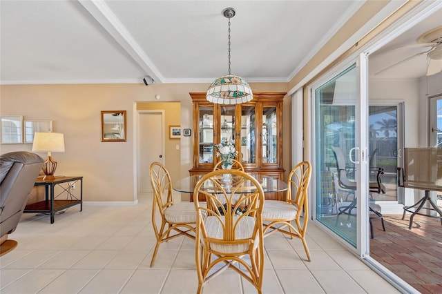 dining space featuring ceiling fan, beam ceiling, ornamental molding, and light tile patterned floors