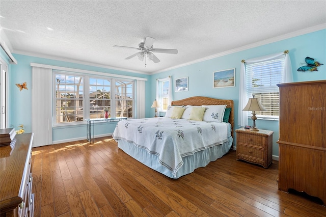 bedroom featuring ceiling fan, a textured ceiling, and hardwood / wood-style flooring