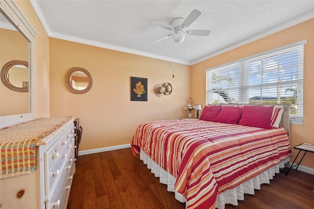 bedroom with a textured ceiling, dark hardwood / wood-style floors, ceiling fan, and ornamental molding