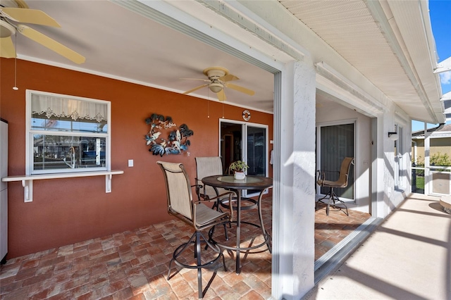 view of patio featuring ceiling fan