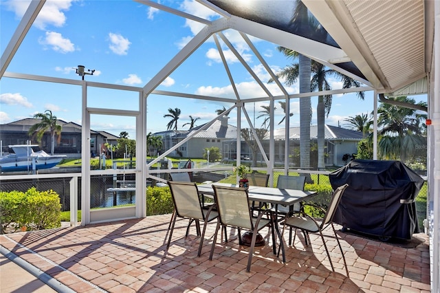 view of patio featuring area for grilling and a lanai