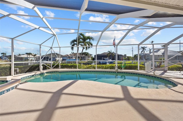 view of pool with a lanai