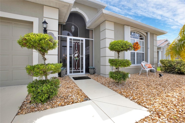 doorway to property featuring a garage