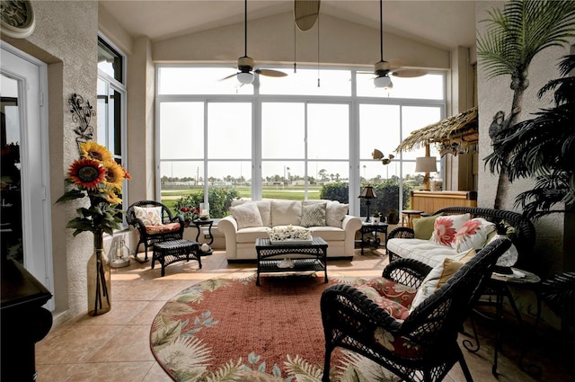 sunroom with ceiling fan and vaulted ceiling