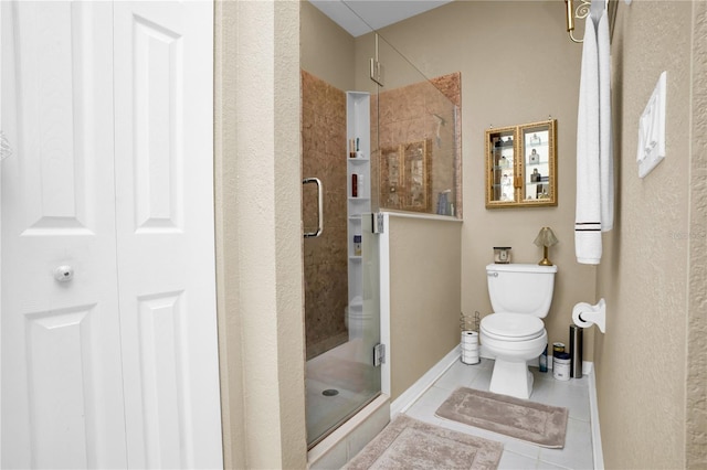 bathroom featuring tile patterned flooring, an enclosed shower, and toilet