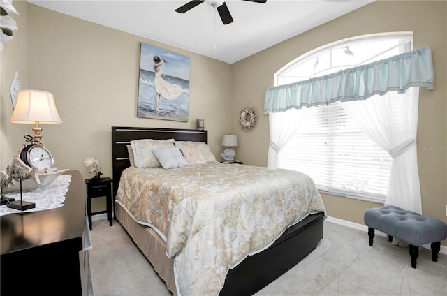 bedroom with light carpet and ceiling fan