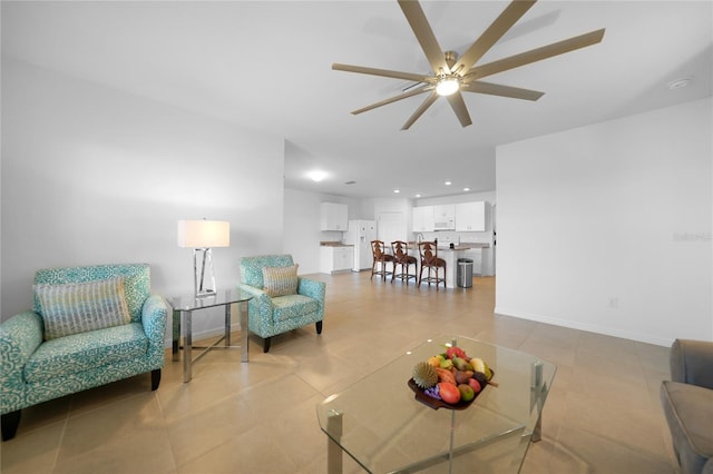 tiled living room featuring ceiling fan