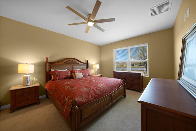 bedroom with light colored carpet and ceiling fan