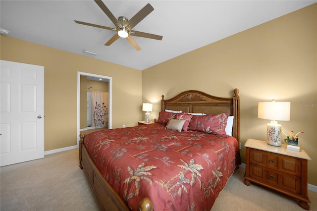 bedroom featuring ceiling fan and light carpet