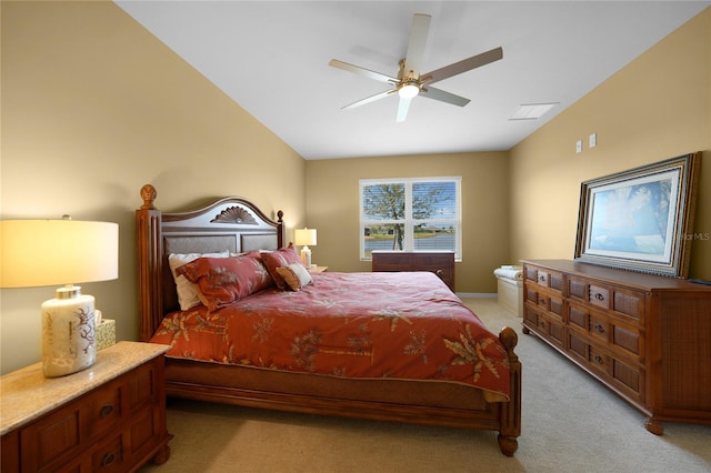 bedroom with light carpet, vaulted ceiling, and ceiling fan