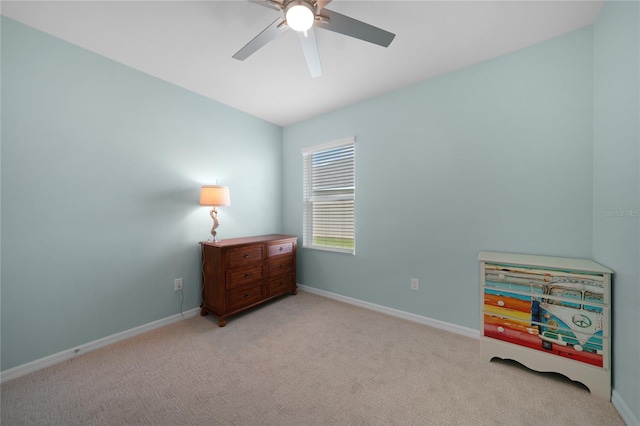 interior space with ceiling fan