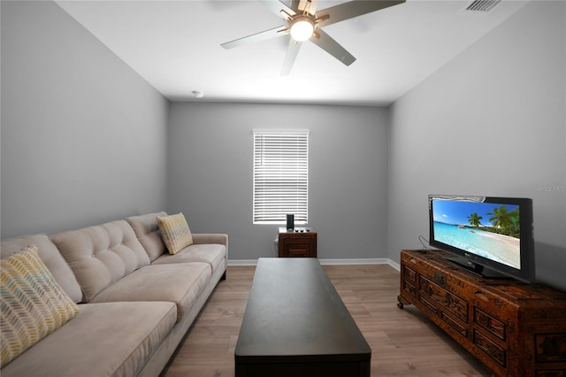 living room featuring ceiling fan and light wood-type flooring