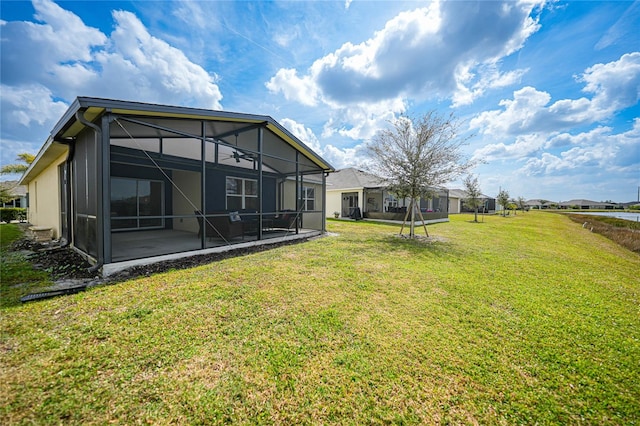 view of yard featuring glass enclosure