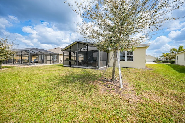 view of yard featuring glass enclosure