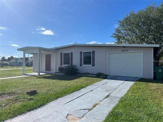 single story home with a front lawn and a garage