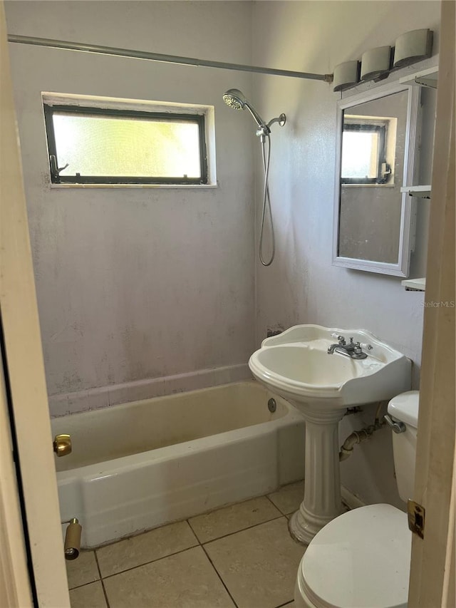 bathroom featuring tile patterned floors, shower / tub combination, and toilet