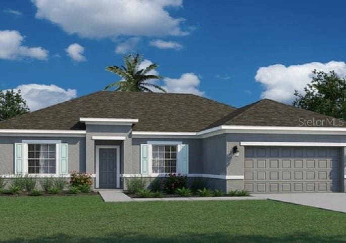 view of front of house featuring a garage and a front yard