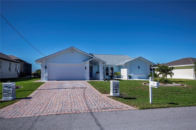 ranch-style house featuring a front yard and a garage