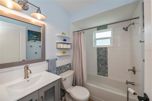 bathroom featuring a wainscoted wall, tile walls, toilet, shower / bath combo, and vanity