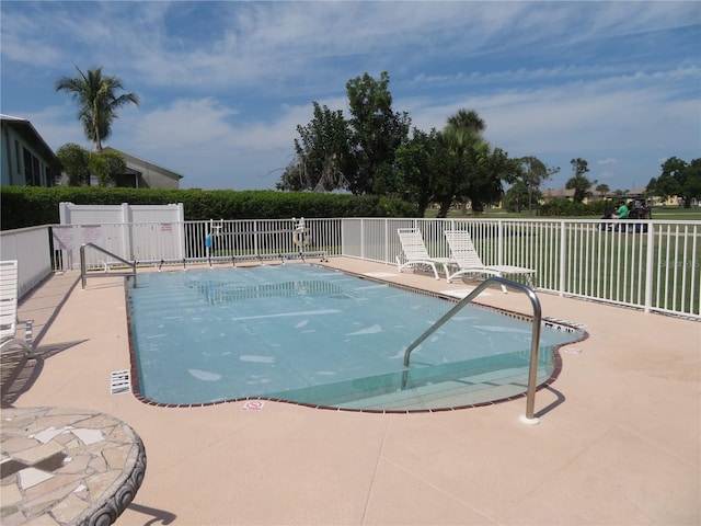 view of pool featuring a patio