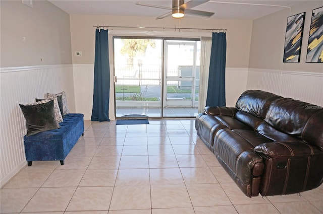 tiled living room with ceiling fan