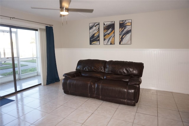 sitting room with ceiling fan and light tile patterned flooring