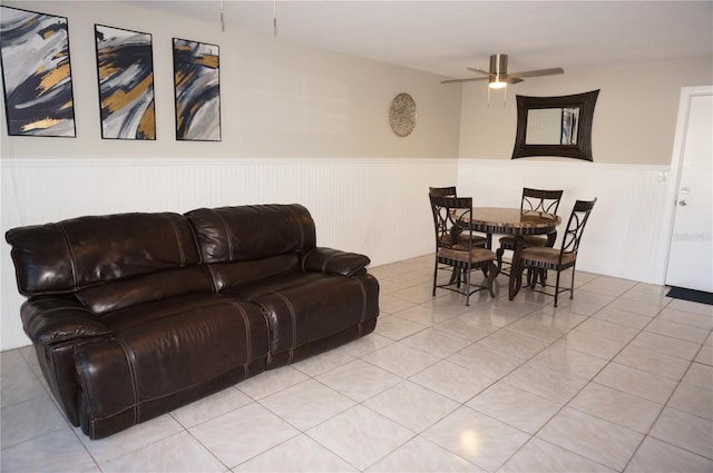 living room featuring ceiling fan and light tile patterned flooring