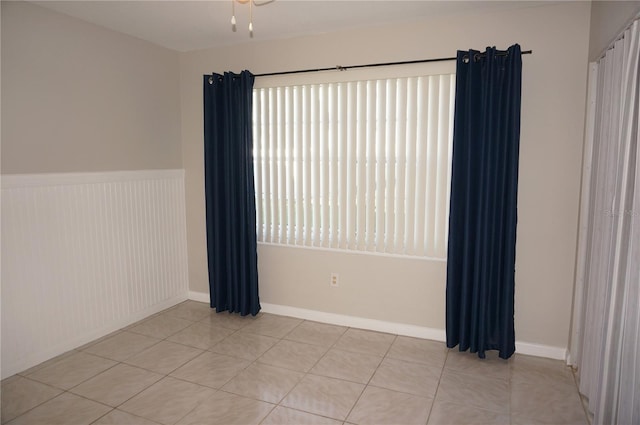 empty room with light tile patterned flooring