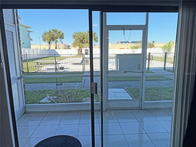 doorway to outside featuring light tile patterned floors