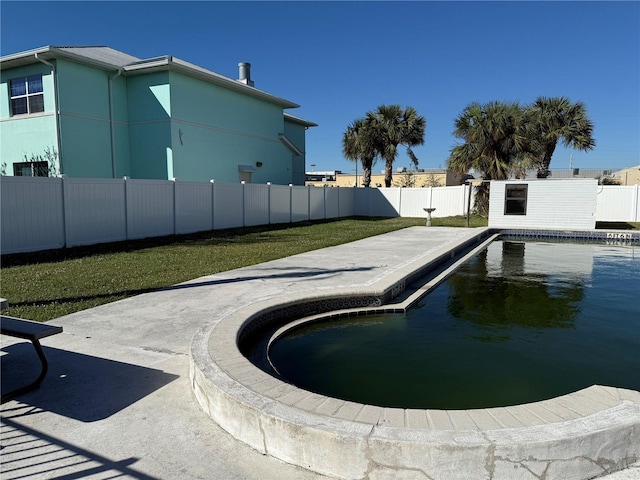 view of pool featuring a patio and a lawn