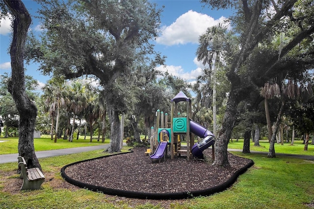 view of jungle gym with a lawn