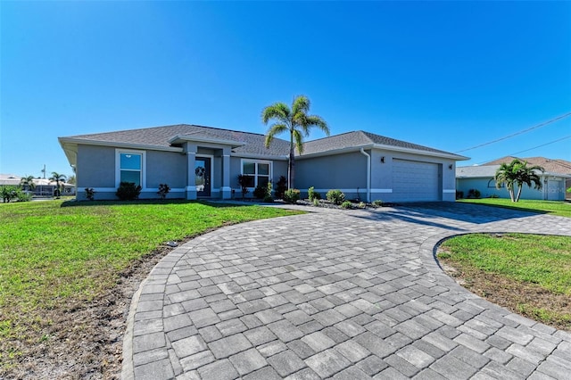 single story home featuring a garage and a front yard