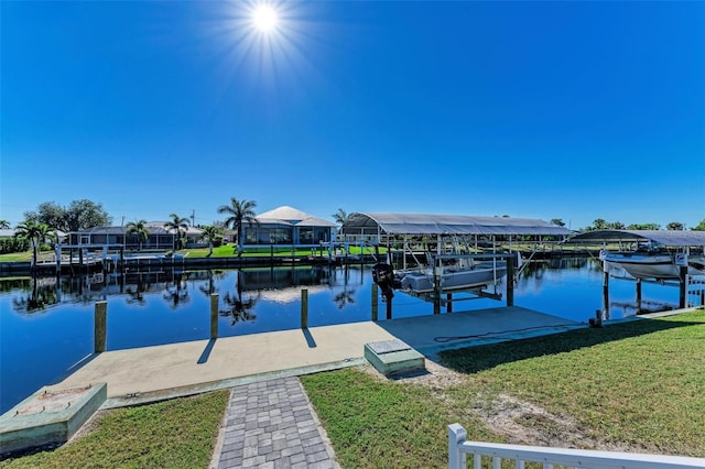 view of dock featuring a lawn and a water view