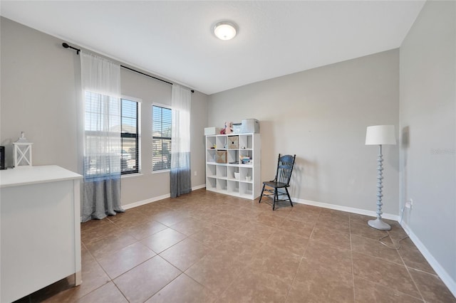 living area with tile patterned flooring