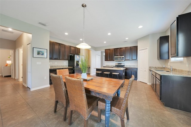 tiled dining space with sink