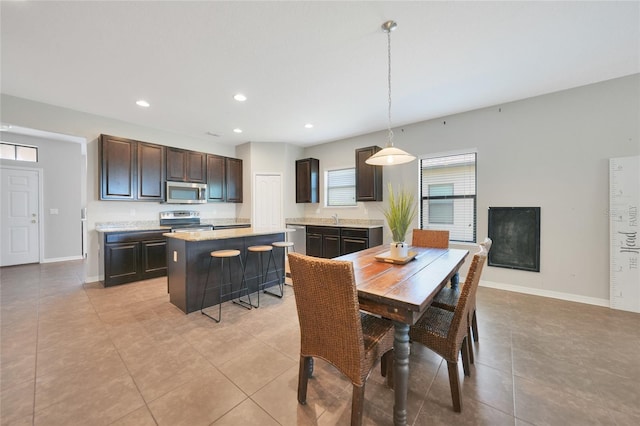 tiled dining area featuring sink