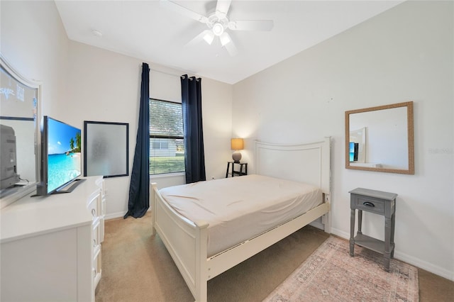 bedroom with light carpet and ceiling fan